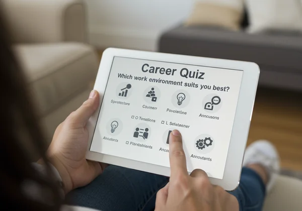 Person taking a career quiz on a modern tablet interface
